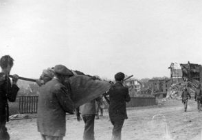 Four German civilians bear a stretcher holding the body of a Nordhausen concentration camp victi.jpg