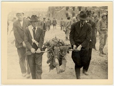german-civilians-carry-corpse-using-pieces-wood-stretcher-nordhausen-concen.jpg