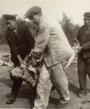 Mittelbau-Dora Liberation and Boelcke Kaserne, Nordhausen, Germany, 1945 - German civilians carry the body of a prisoner from the Nordhausen concentration camp to a mass g