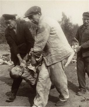 German civilians carry the body of a prisoner from the Nordhausen concentration camp to a mass g.jpg