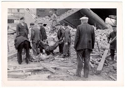 german-civilians-remove-corpse-rubble-nordhausen-concentration-camp.jpg
