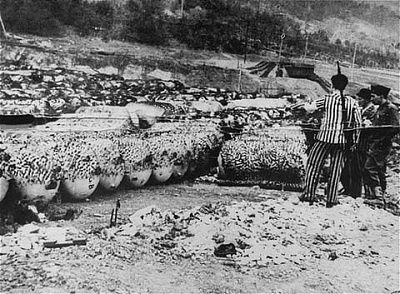 liberated-inmates-view-area-where-camouflaged-v-1-v-2-rocket-parts-were-stored.jpg