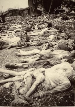 The bodies of prisoners lie on the ground in the newly liberated Nordhausen concentration camp1.jpg
