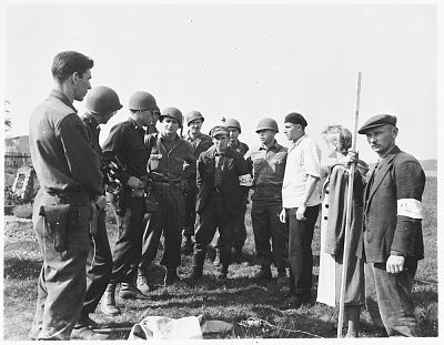 american-military-authorities-question-german-civilian-estedt-pictured-third-right-.jpg
