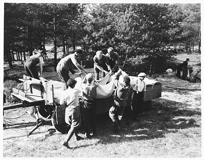 german-civilians-load-corpses-exhumed-mass-grave-onto-wagon-transported-prop.jpg
