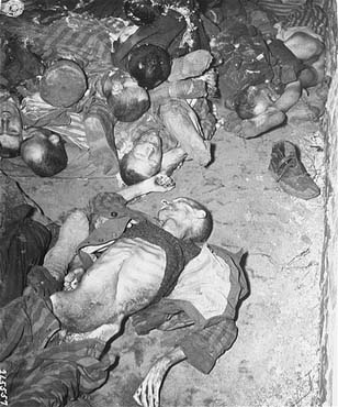 The bodies of former prisoners lie on the floor of a barracks0.jpg