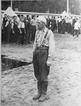 A Polish POW stands at attention in the roll call area (Appellplatz) at the Stutthof concentrati.jpg