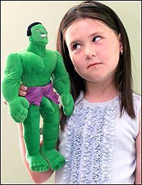 Stunned ... Leah, six, with doll.jpg